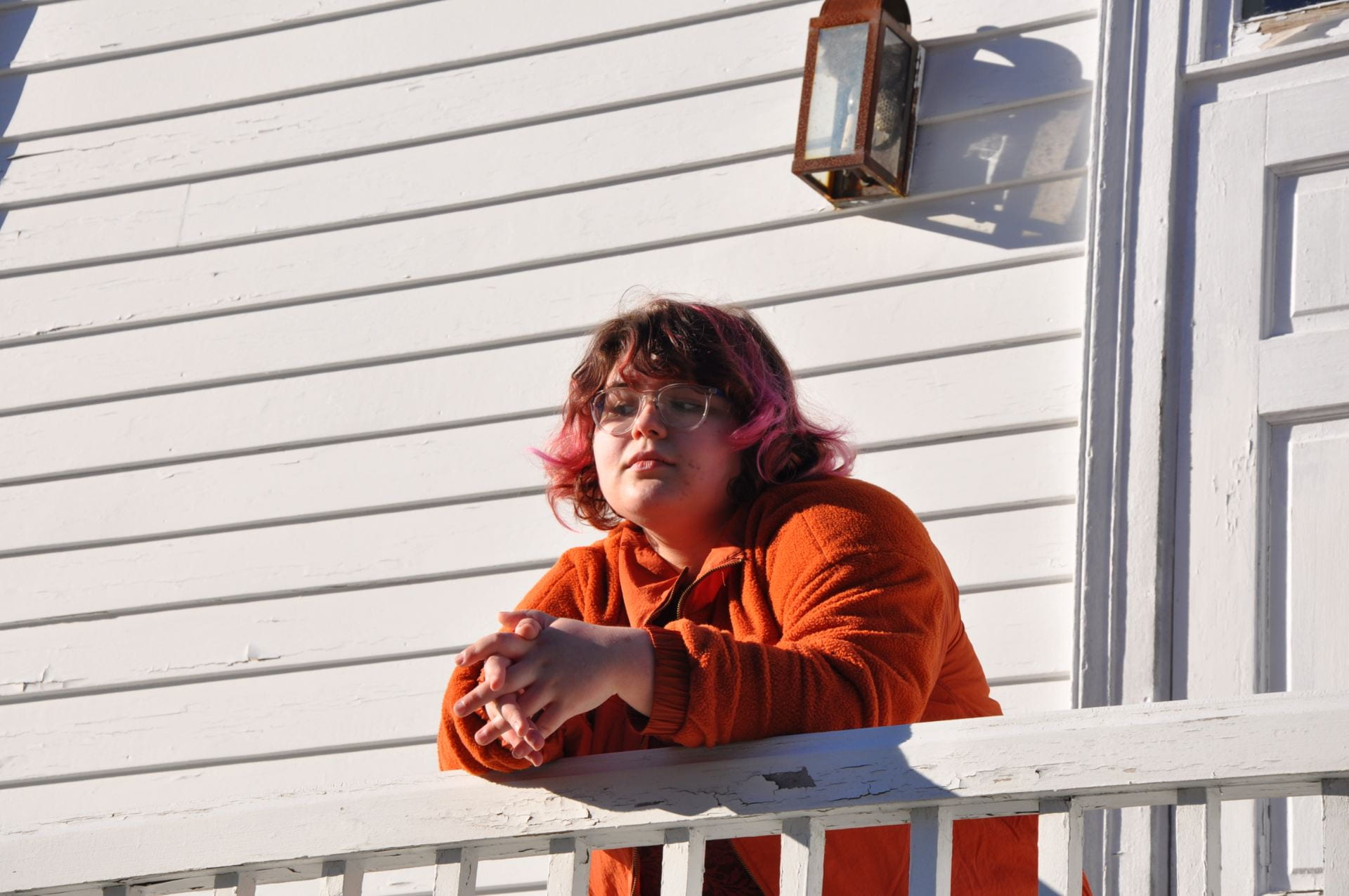 Image of Lilah Kamins leaning against a railing.